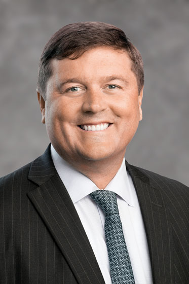 Patrick-McCarter-Headshot-2024-GreyBG-Web